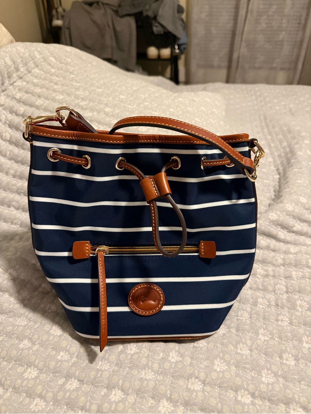 Dooney & Bourke Navy and White Striped Crossbody Bucket Bag with Tan Trim